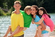 Happy children by lake
