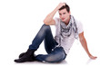 Photo: young casual happy man seated young casual happy man seated