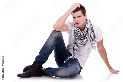 Photo: young casual happy man seated young casual happy man seated