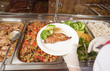 Foto: chef standing behind full lunch service station chef standing behind full lunch service station