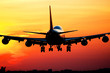 Plane landing by sunrise