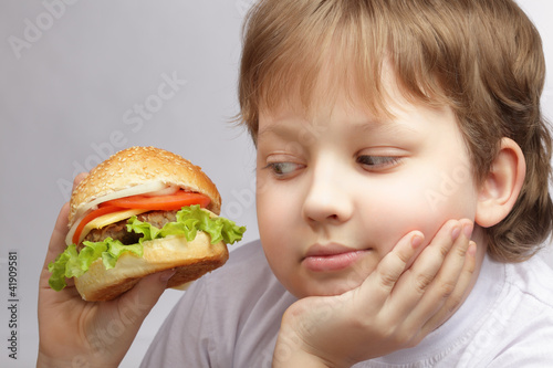 Photo: happy boy with burger happy boy with burger