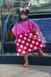 Little Girl near the pool covering on beach towel