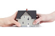 Foto: Two hands trying to divide house, isolated Two hands trying to divide house, isolated