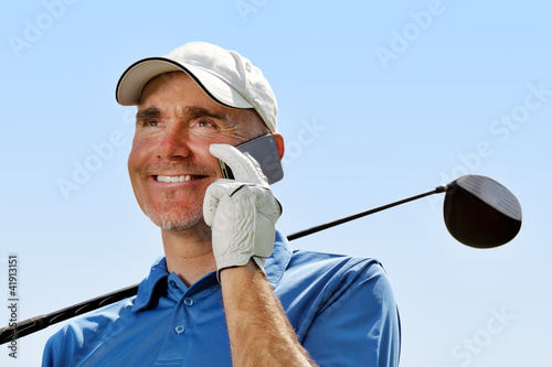 Photo: Golfer using mobile phone Golfer using mobile phone