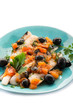 fish fillet with tomatoes balck olives and pepper
