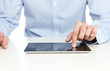 Close up of young businessman using digital tablet
