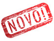 Palavra "novo" - carimbo vermelho desgastado