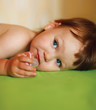 Cute baby girl with a soother in her mouth
