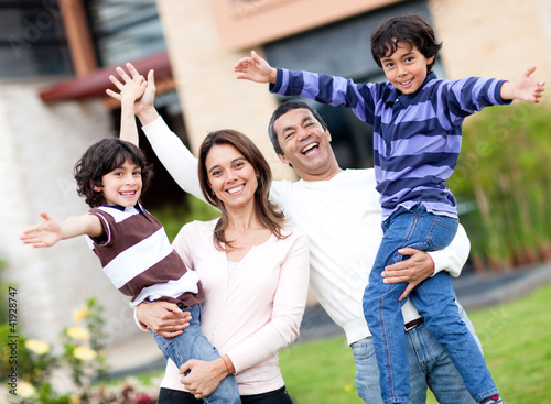 Photo: Excited family outdoors Excited family outdoors