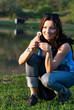 Young woman with dandelion
