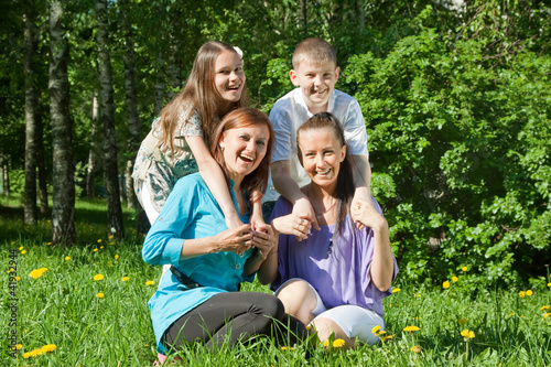 Photo: Two happy women with teens Two happy women with teens