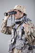 Soldier looking through binoculars