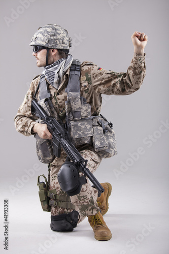 Photo: soldier with hand warning gesure soldier with hand warning gesure