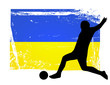 soccer player in front of the ukraine flag