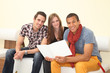 friends reading a brochure