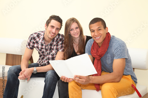 Photo: friends reading a brochure friends reading a brochure