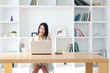 Photo: Beautiful young woman using a laptop computer Beautiful young woman using a laptop computer