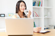 Beautiful young woman using a laptop computer