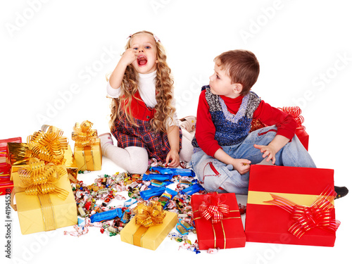 Foto: Children with gift box and sweet. Children with gift box and sweet.
