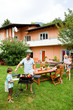 Family having a barbecue in the garden, eating