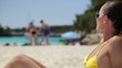 Video: Beautiful woman sunbathing on public beach, dolly shot Beautiful woman sunbathing on public beach, dolly shot