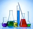 Chemical glasswares with colored liquids inside bottles
