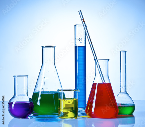 Photo: Chemical glasswares with colored liquids inside bottles Chemical glasswares with colored liquids inside bottles