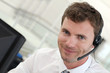 Portrait of salesman with headset on