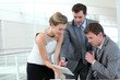 Photo: Group of business people meeting around table Group of business people meeting around table