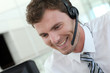 Portrait of salesman with headset on