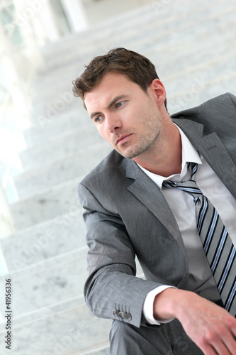 Photo: Portrait of exhausted businessman because of job loss Portrait of exhausted businessman because of job loss