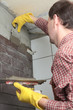 Contractor installing tiles
