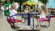 Children wave their hands on the carousel, and clap their hands