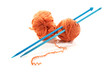 Balls of a yarn knitting spokes on white background
