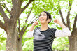 young asian woman relaxing in the forest