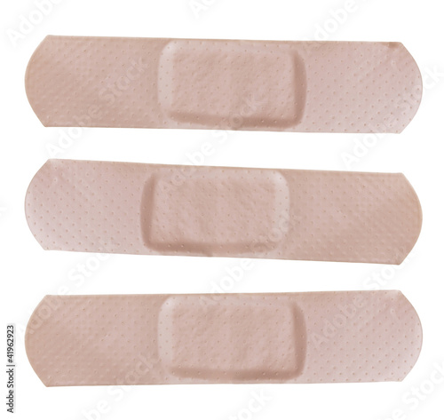 Photo: Adhesive bandages isolated on white Background Adhesive bandages isolated on white Background