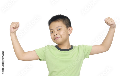 Photo: portrait of an innocent little boy flexing biceps portrait of an innocent little boy flexing biceps