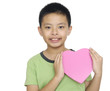 Photo: Child holding golden gift heart box in hand Child holding golden gift heart box in hand