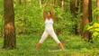 Video: Young woman doing yoga exercise in green park Young woman doing yoga exercise in green park