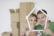 Photo: Young couple moving in new home Young couple moving in new home