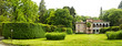 panorama of manor house with  green meadow