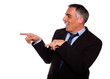 Friendly hispanic businessman pointing