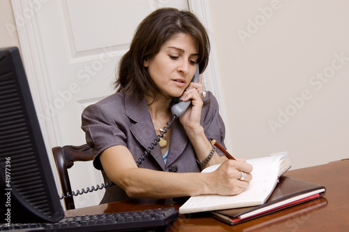 Photo: Businesswoman in home office Businesswoman in home office