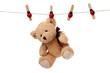 Foto: Teddy bear hanging on clothesline Teddy bear hanging on clothesline