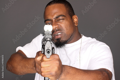 Photo: Gangster with an assault gun. Gangster with an assault gun.