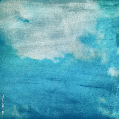 Photo: clouds on a textured paper background clouds on a textured paper background