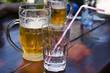 A glass of water and a mug of beer