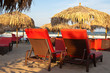 Two deck chairs on the beach