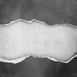riped vintage paper on grunge background